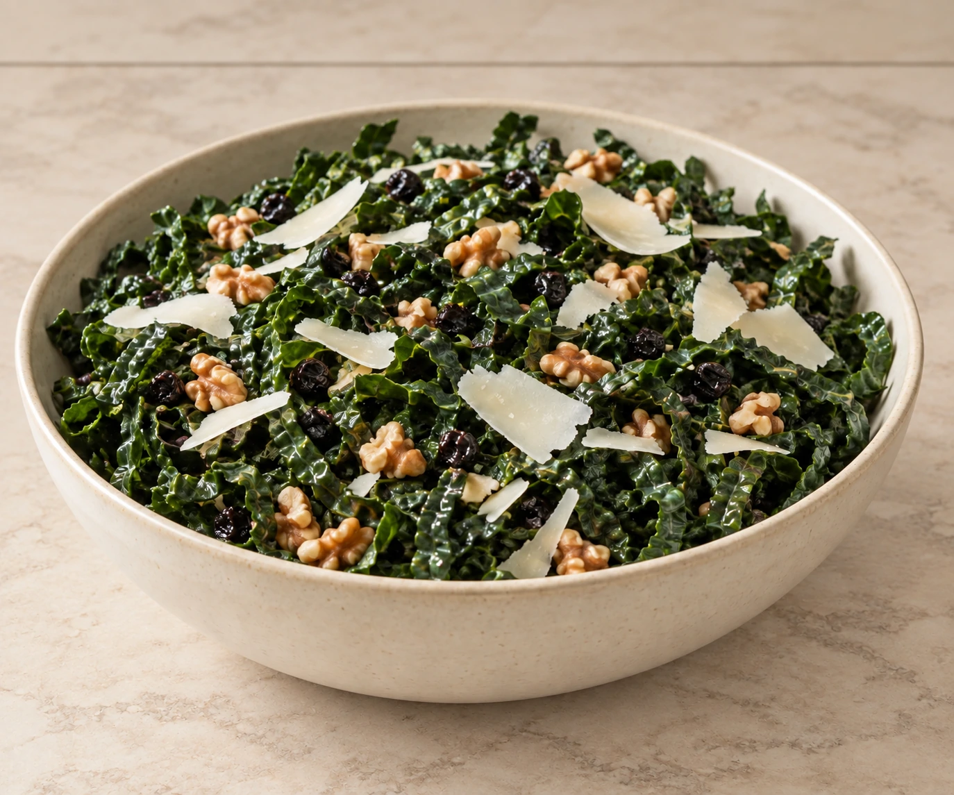 Six-serving kale salad with currants, prepared walnuts and shaved Pecorino
