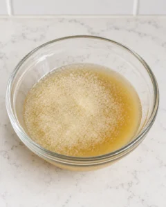 One tablespoon gelatin blooming in half a cup of fresh apple juice