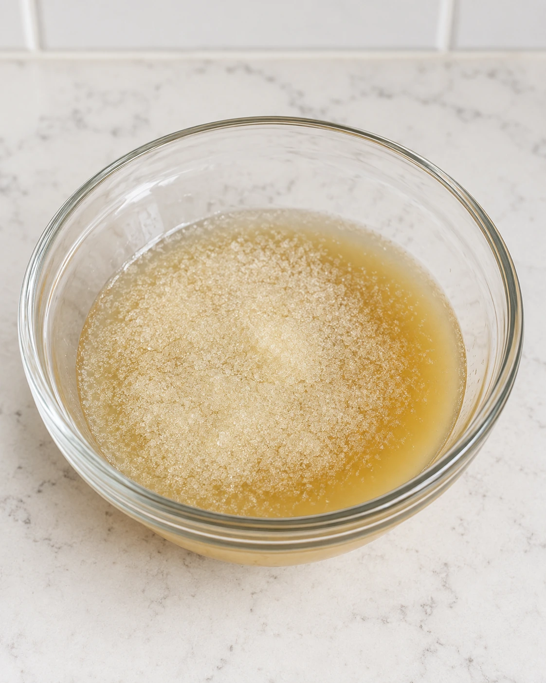 One tablespoon gelatin blooming in half a cup of fresh apple juice