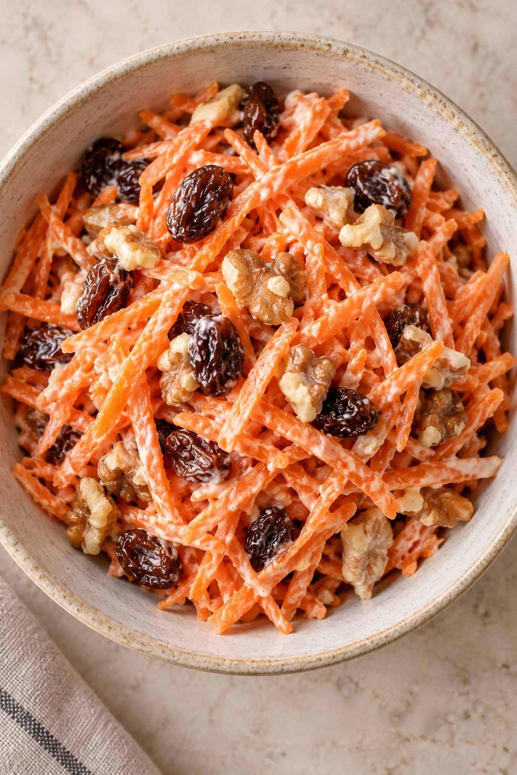 Overhead view of GAPS carrot salad lightly coated with homemade yogurt