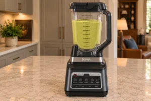 Smooth pale green zucchini hummus at the stopped Ninja BN801 blender endpoint