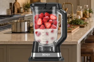 Frozen strawberries and homemade milk loaded in the exact Ninja BN801 before blending