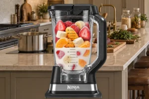 Frozen banana orange and strawberries loaded in the exact Ninja BN801 with homemade milk