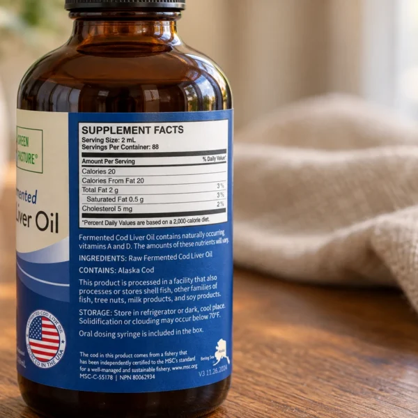 Close view of the ingredient and Alaska cod statement on a Green Pasture cod liver oil bottle.